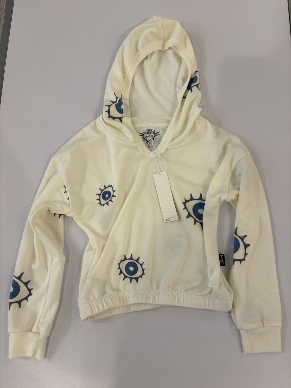 T2 Love Cream Hoodie with Blue Eye Motif